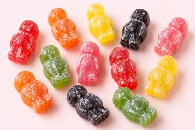 Jelly Babies. Jelly babies, the little baby shaped figure with a round head, arms at the sides and short legs, in red, orange, yellow, green, pink and black.
